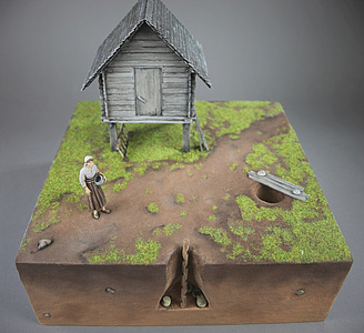 Im Modell dargestellt: Kegelstumpfgrube mit Haus (Foto: Keltenwelt am Glauberg)